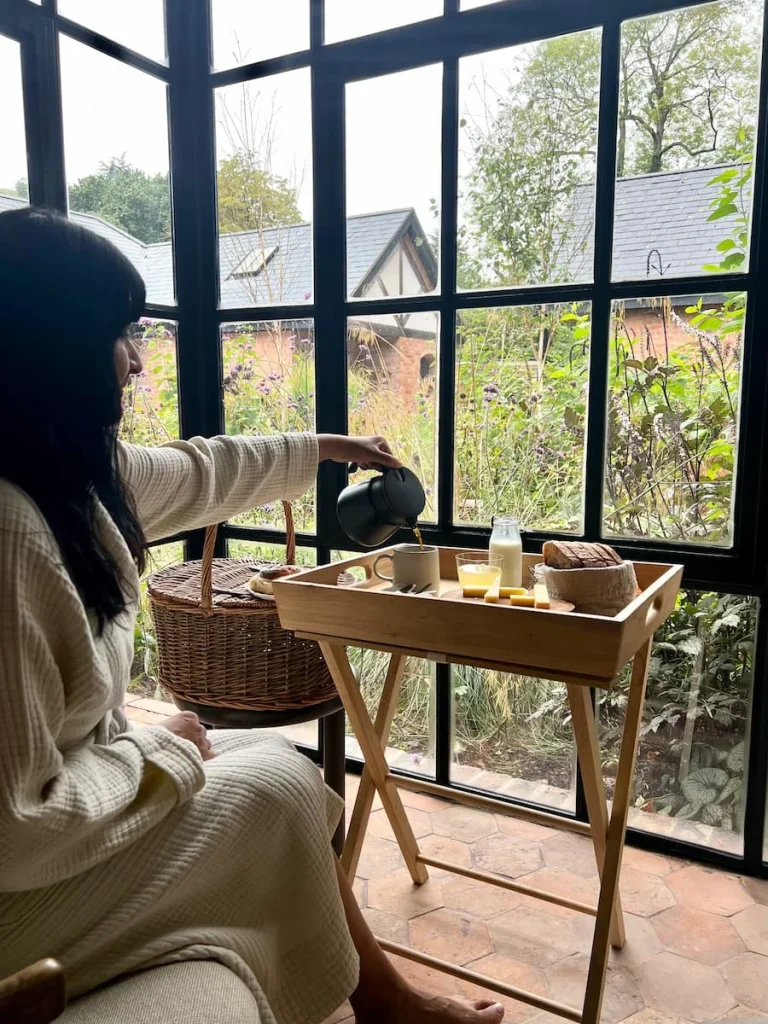 Bejal pouring coffee at Grace & Savour, Hampton in Arden