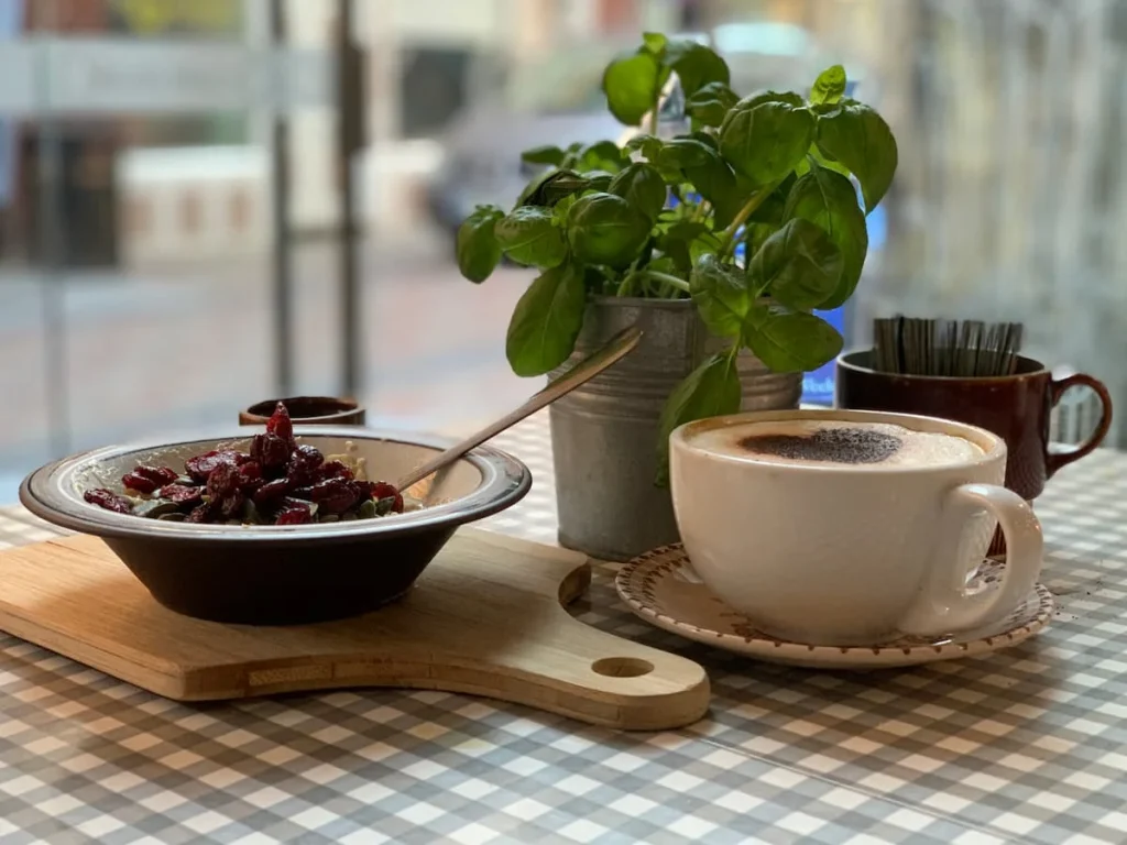 Fruit and porridge with coffee at Bryter Moon Deli