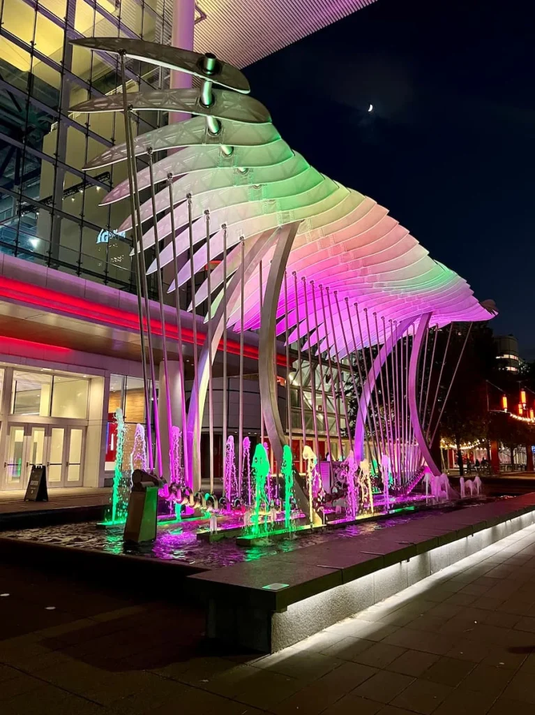 3 days in Houston: Wings above water feature at night with lights and fountain
