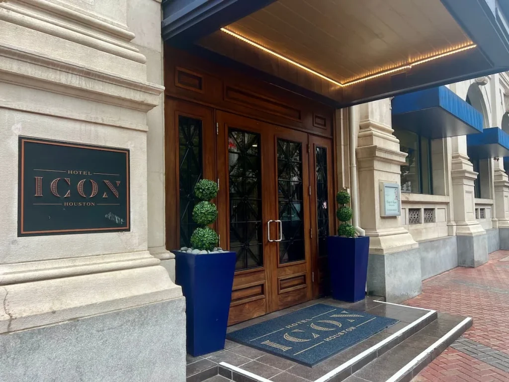 Places to stay in Houston by neighbourhood: Exterior of Hotel Icon with plaque adn double wooden doors