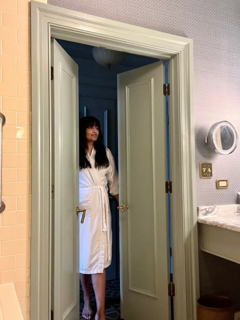 Bejal walking int bathroom at Hotel icon, HOuston