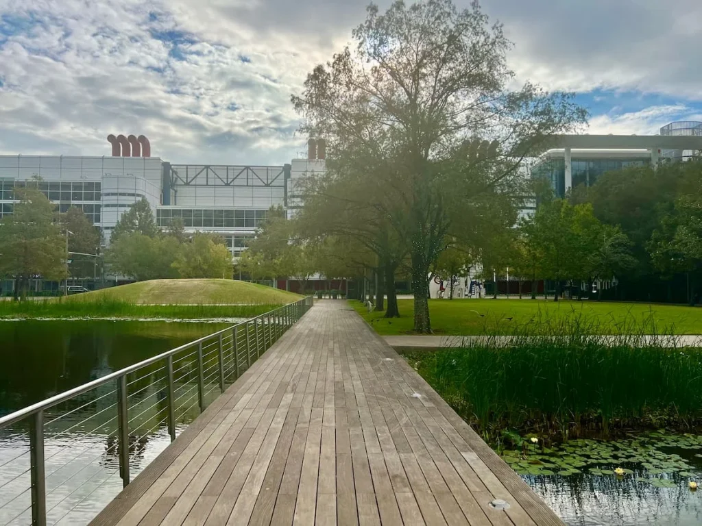 Sustainable Houston Guide: Discovery Green lake with boardwalk