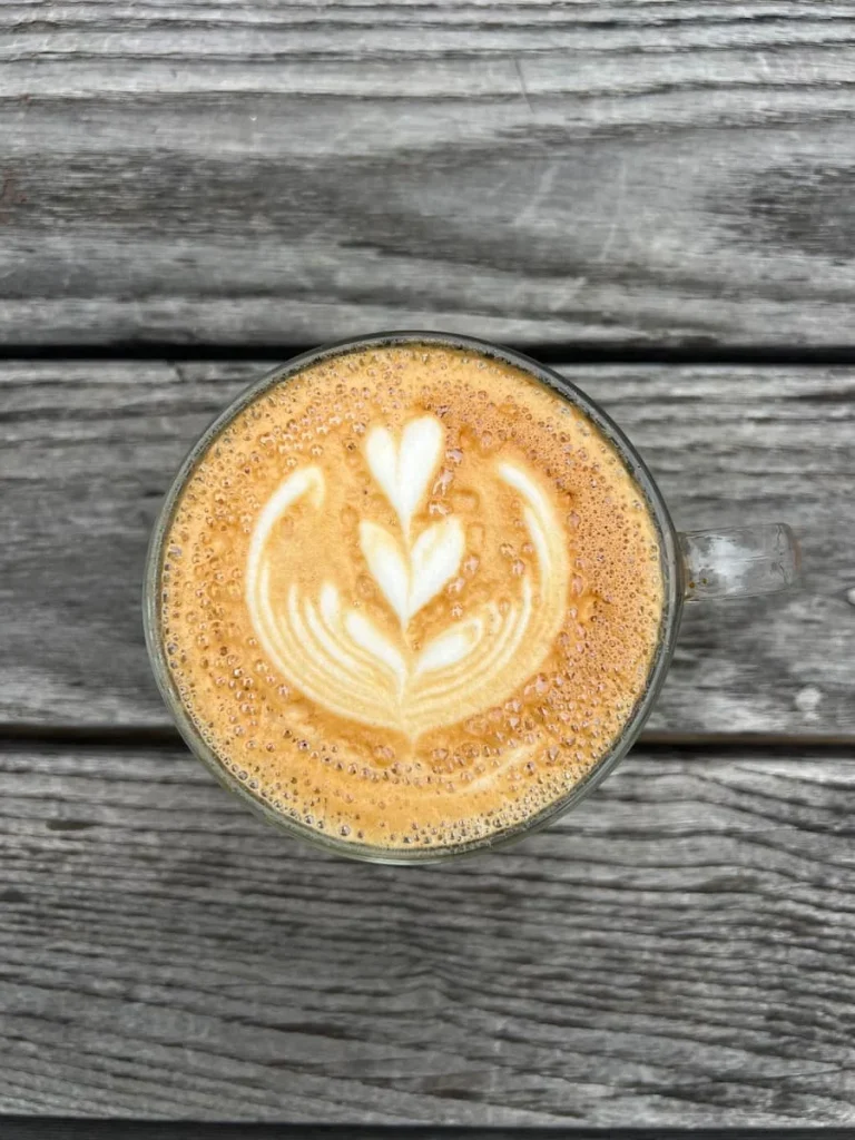 Cappuccino with coffee art top lay at Toute Suite, Houston