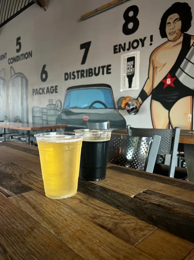 Dark and light craft beers inside 8th Wonder Brewery