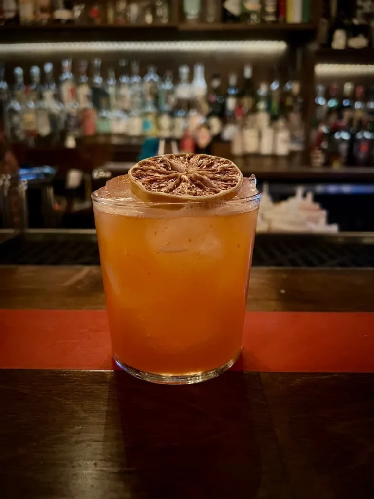 Vegetarian food in Houston: Tiny Champions  cocktail on bar