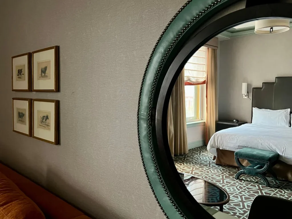Sustainable Houston Guide: Hotel Icon Mirror in bedroom with bed reflection