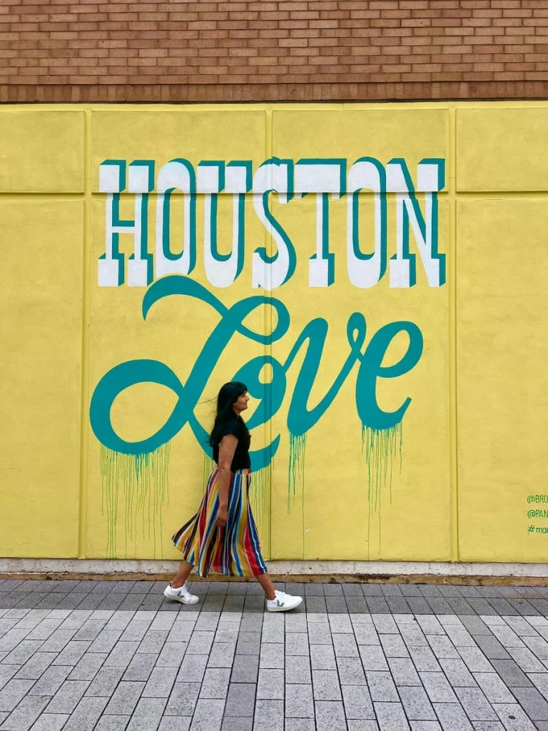 photo locations in Houston: Houston Love Mural with Bejal doing a stride-by