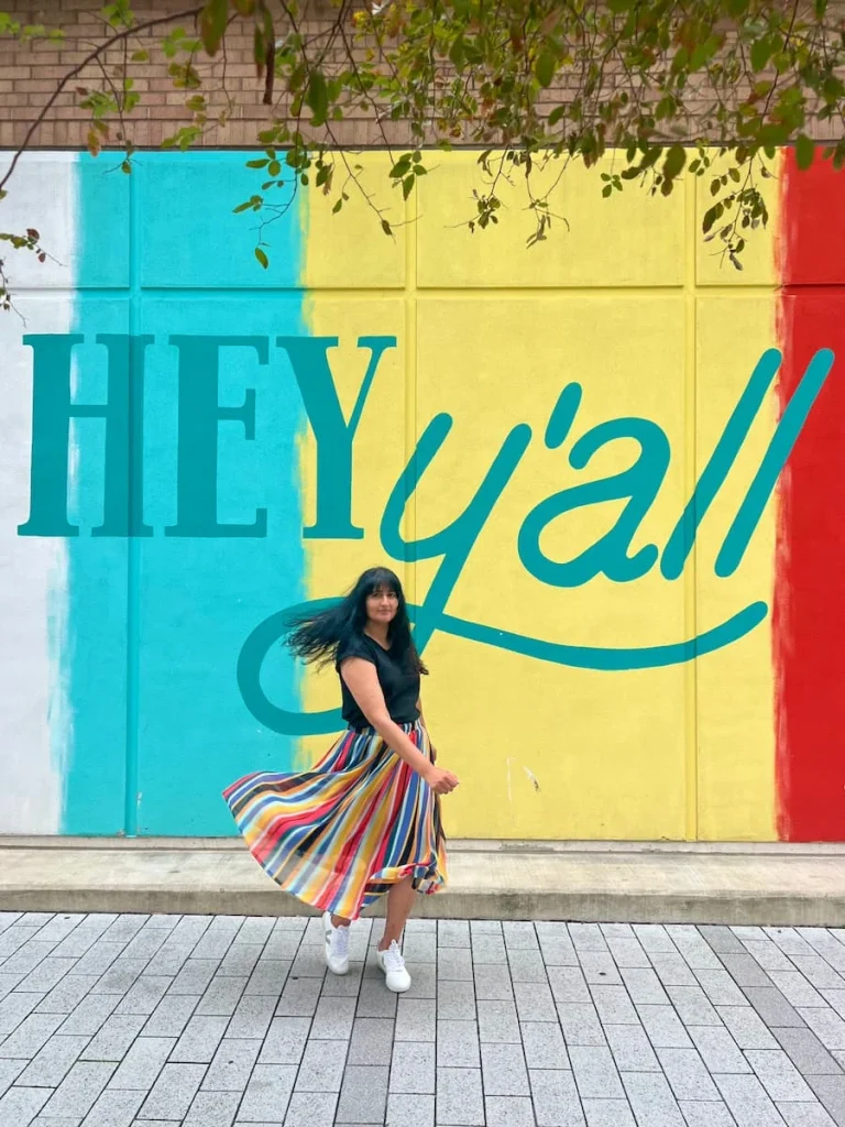 photo locations in Houston: Hey Y'all  with Bejal twirling in front of it