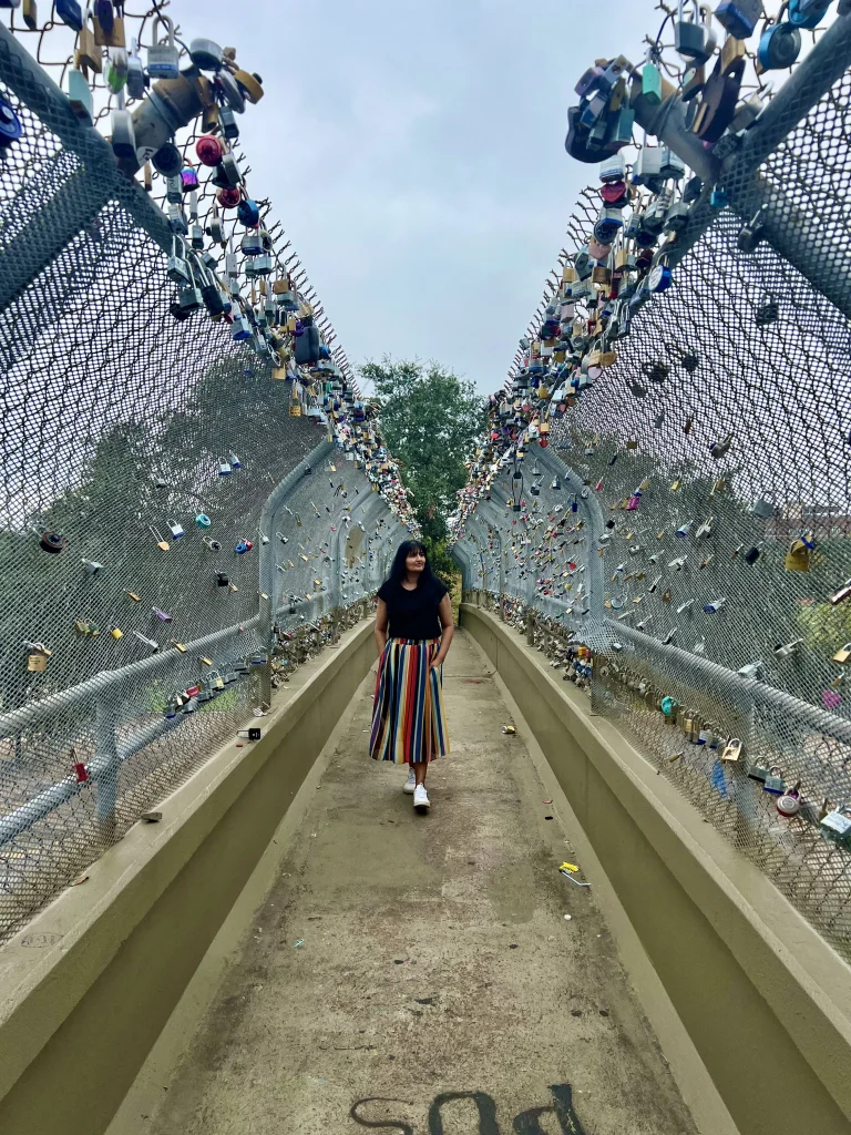 Photo locations in Houston: Love Lock Bridge with Bejal walking down bridge 