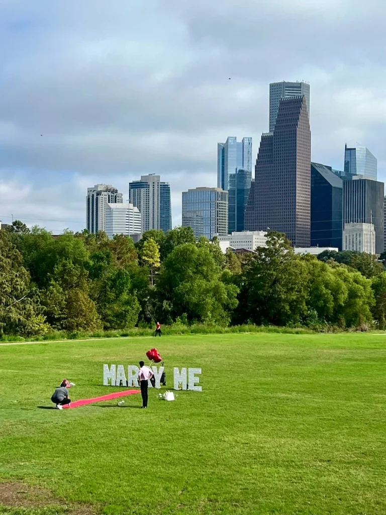 Photo locations in Houston: Hermann Park with Marry Me Sign and downtown skyline in the back