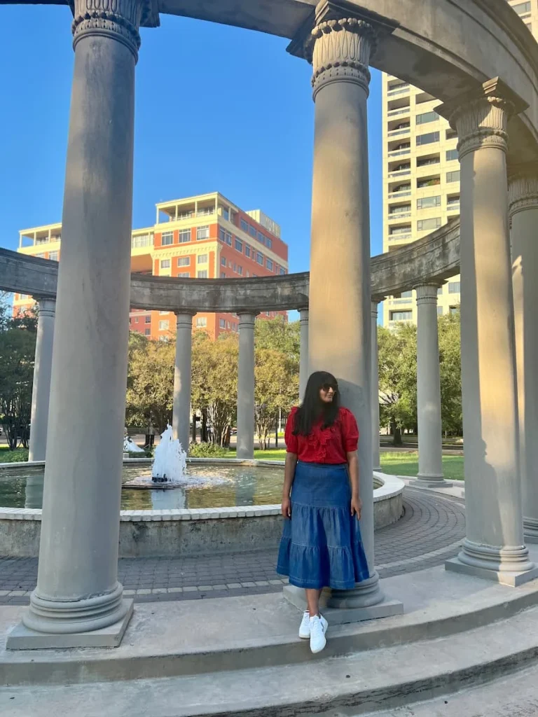 photo locations in Houston: Bejal standing at column of Mecom Rothwell Colonnade