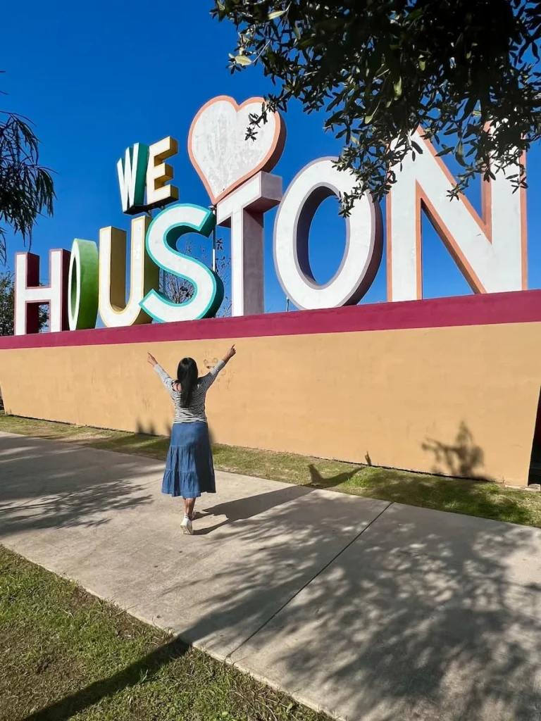 Photo locations in Houston: We love Houston sign with bejal pointing to it in front