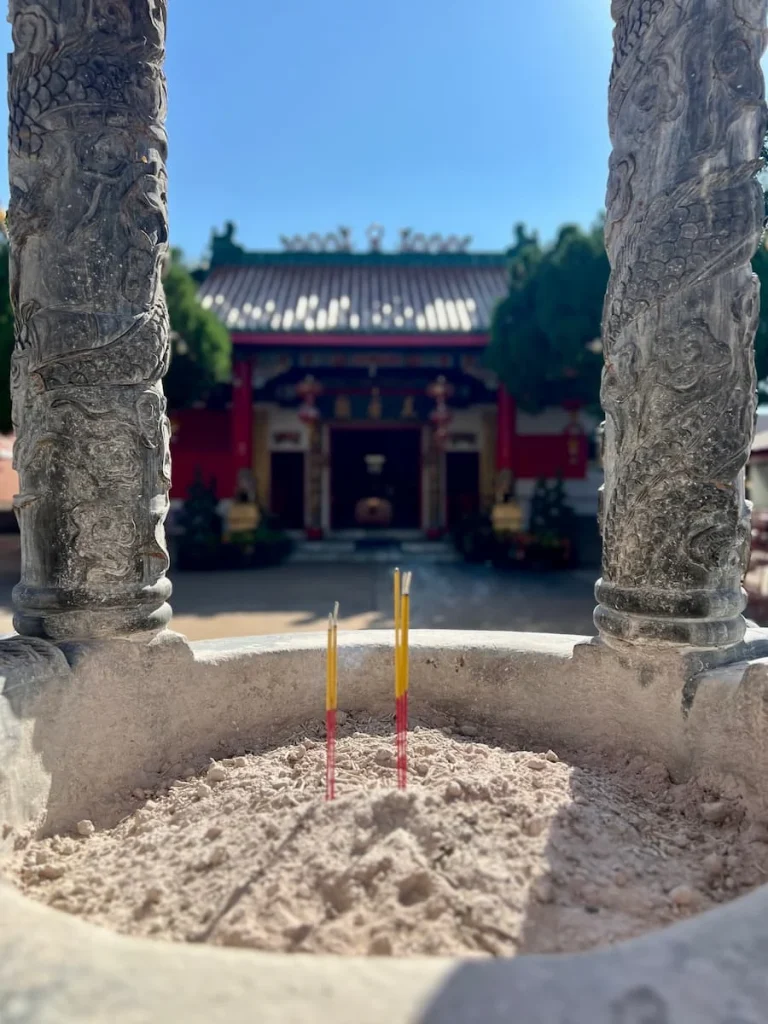 Photo locations in Houston: shrine in Teen How Taoist Temple seen from window in incense holder