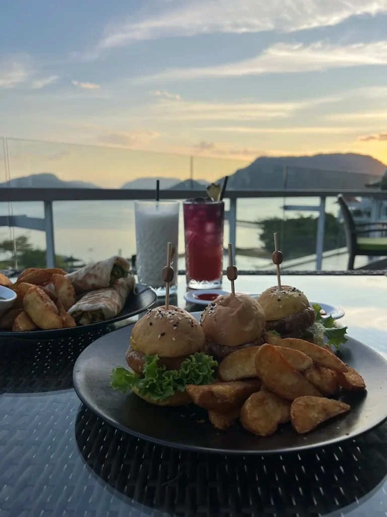 vegan and Vegetarian food in Langkawi: Mocktails with paneer paratha and aloo tikki sliders with Andaman see in the background at Breeze, The Westin.