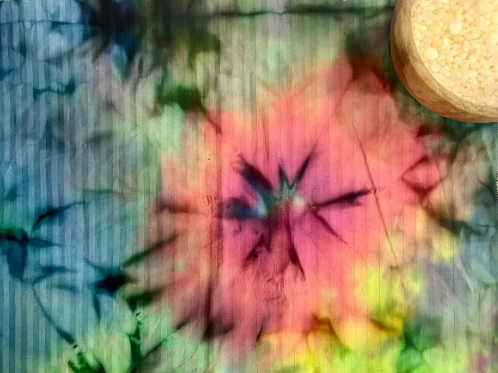 Things to do in Langkawi: Batik making workshop at  The Datai, Langkawi. Pink, black, teal and yellow flowers on the Batik fabric