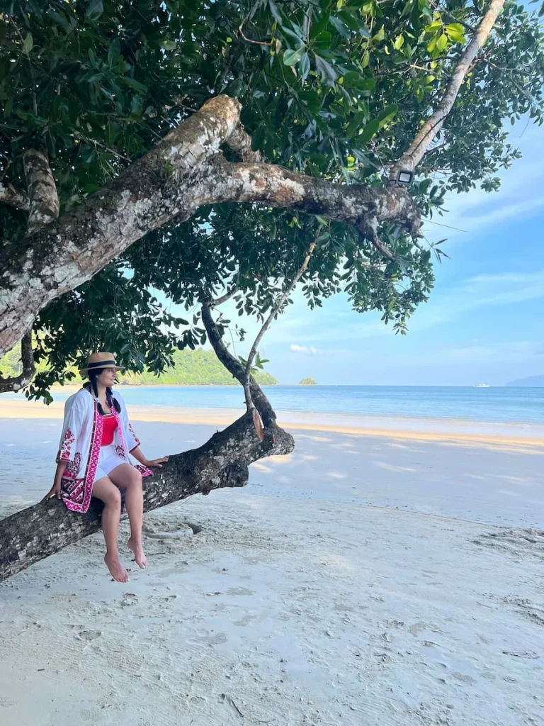 Datai Langkawi beach staff cleaning Bejal's sunglasses on the beach