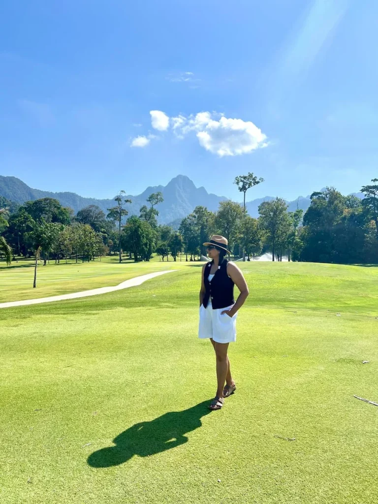 Sustainable luxury Datai Langkawi: Bejal standing in front of mountain and gof green at Els Golf Club, Teluk Datai