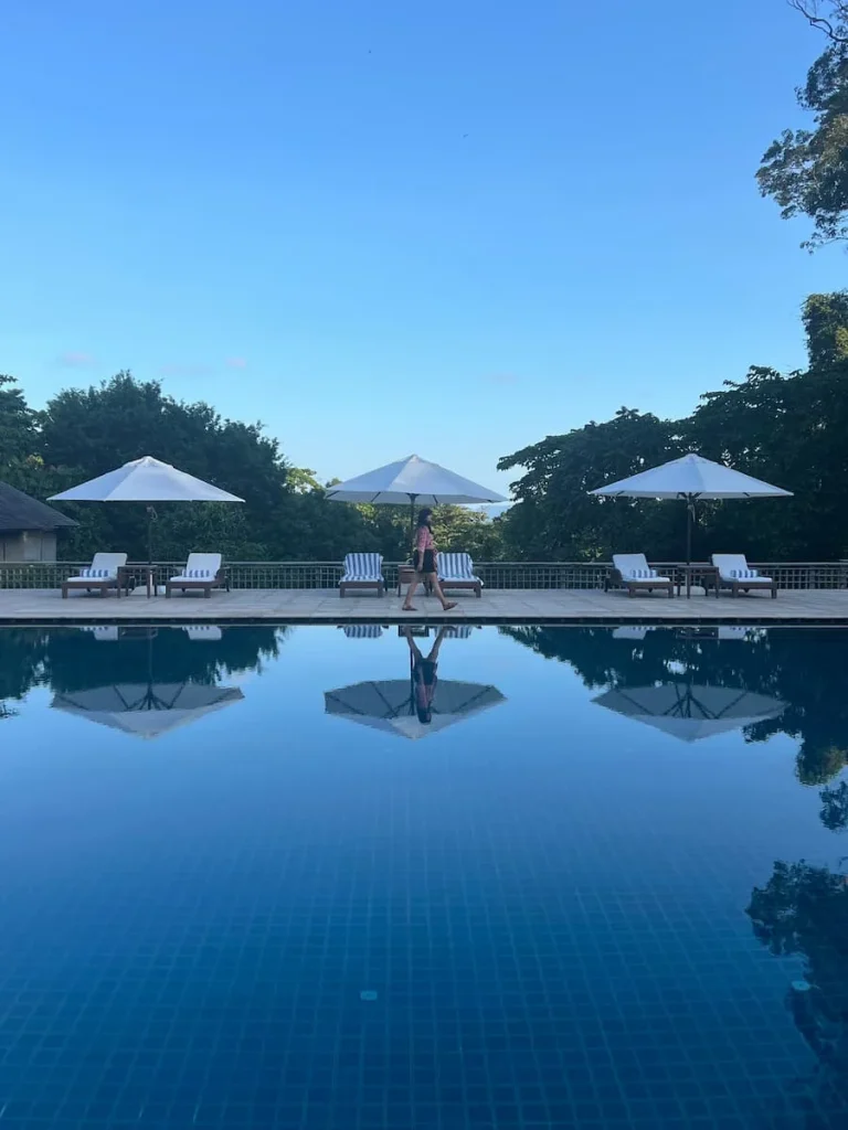 Sunbeds and white umbrellas at Main Pool at The Datai Langkawi