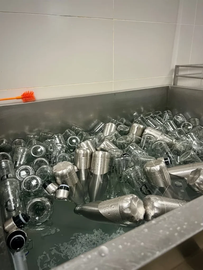 Sustainability at The Datai Langkawi: Cannisters of the Datai water which are being cleaned ready for refilling jpg