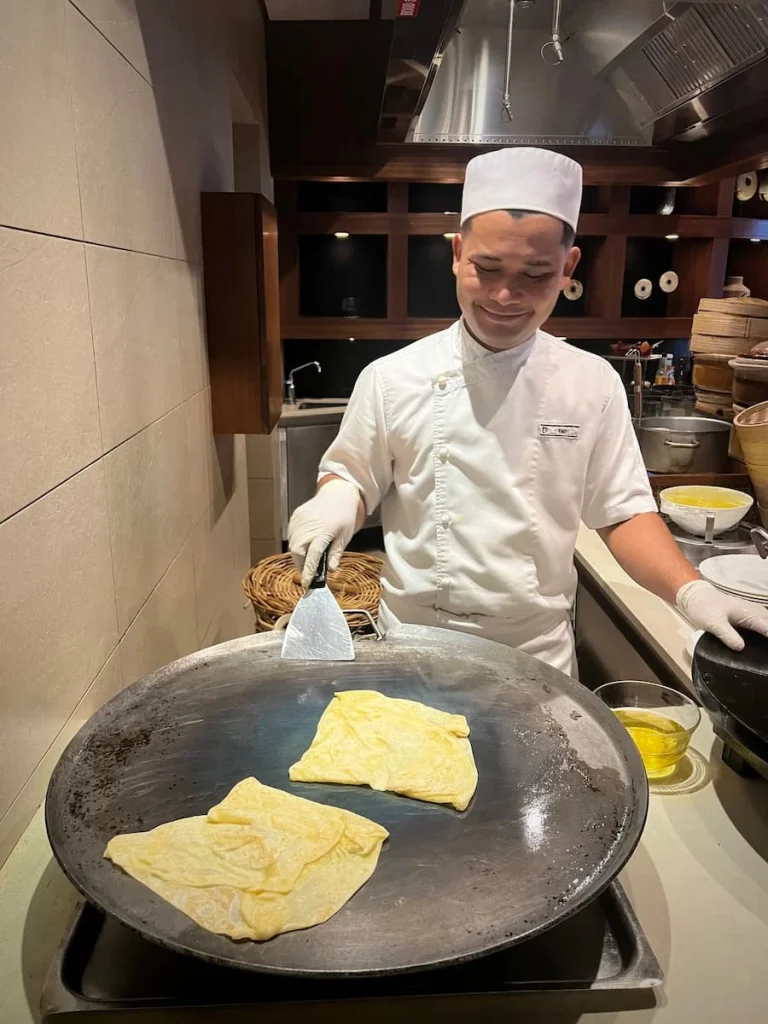 Vegan and Vegetarian food in Langkawi: Chef folding roti canai at The Datai Langkawi