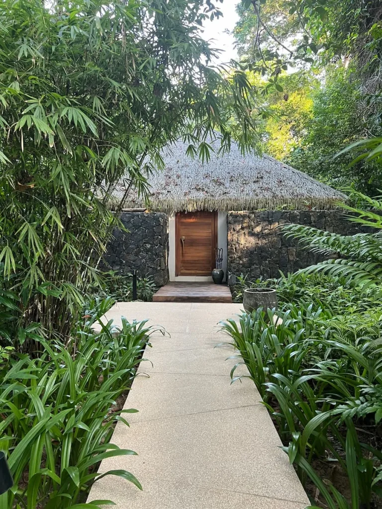 Exterior of spa room with brown door at The Datai Langkawi