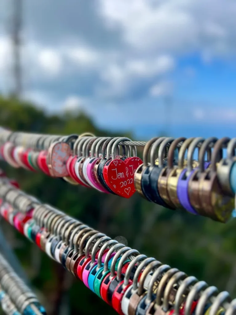 Things to do in Langkawi: rows of multicolour love pad locks at SkyCab middle station
