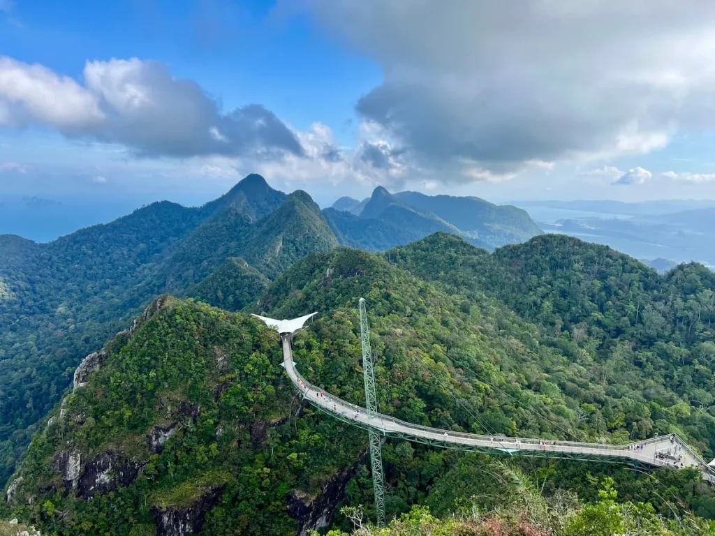 Things to do in Langkawi: A panoramic view of the SkyBridge from the first Skycab station with people walking on bridge