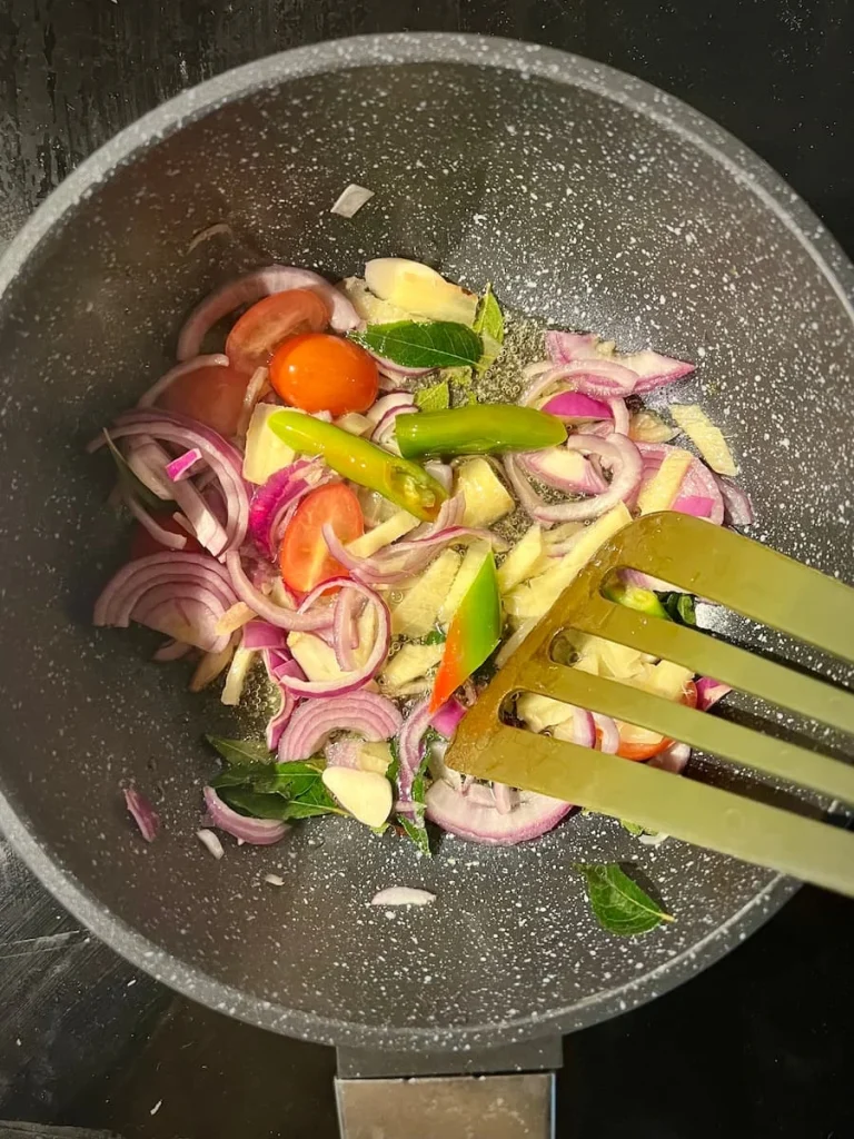 Bejal carrying a plate of vegetables