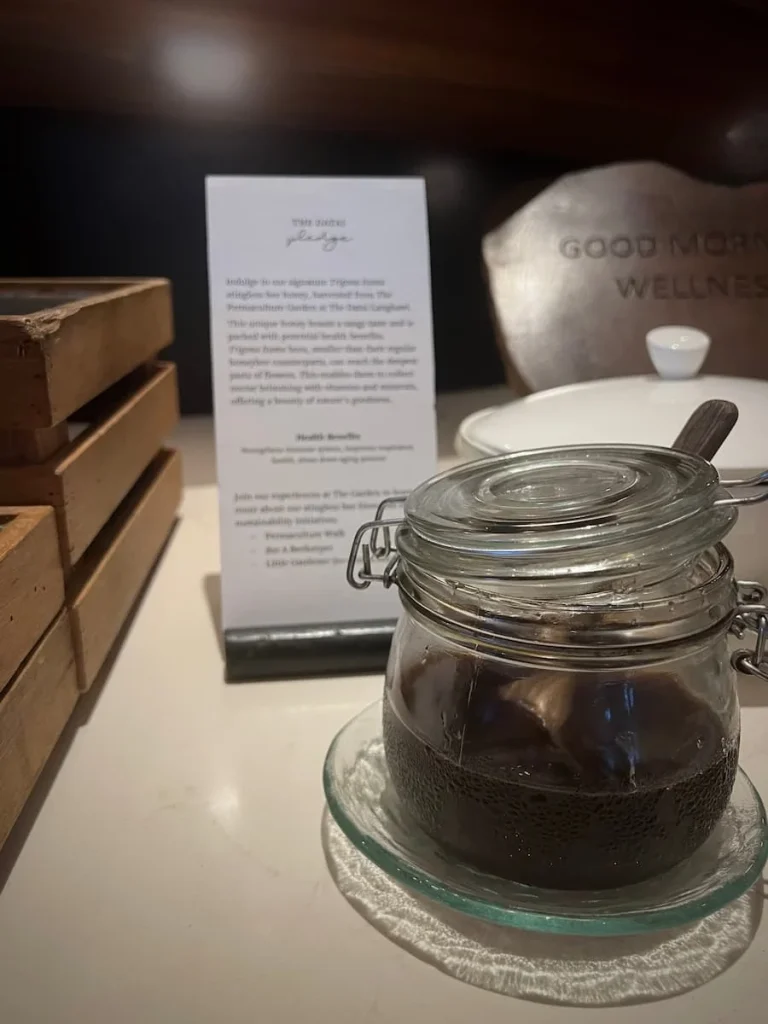 Sustainability at The Datai: The Datai honey in a pot with an explanation of the bee farmer and workshops on a card behind