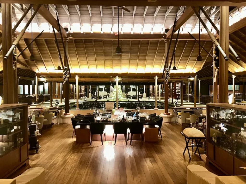 The Lobby Bra at The Datai Langkawi at night with Barman making drinks in the central bar