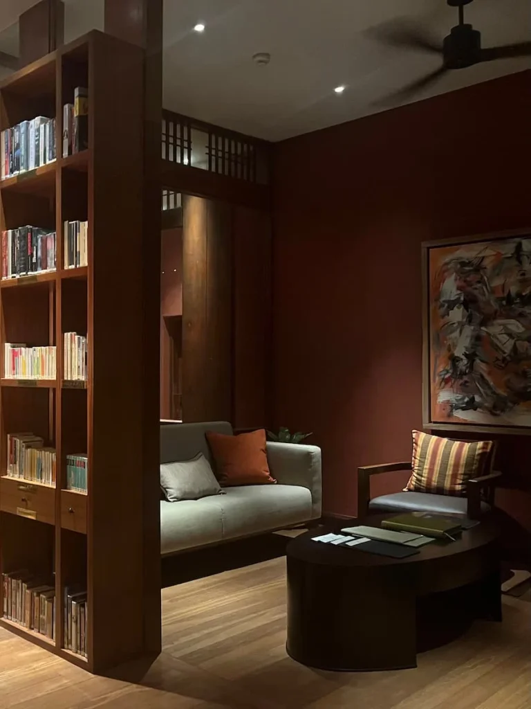 The Datai Langkawi entrance sign in gold with a stoned background