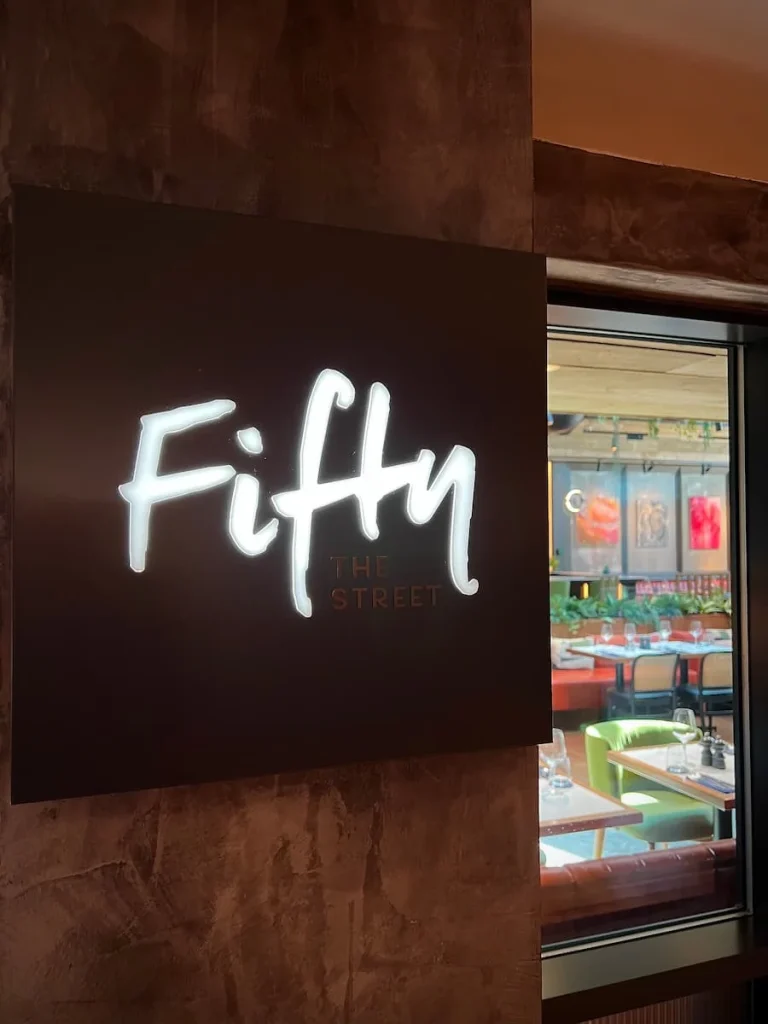 Fifty The Street restaurant sign in neon white, Loughborough