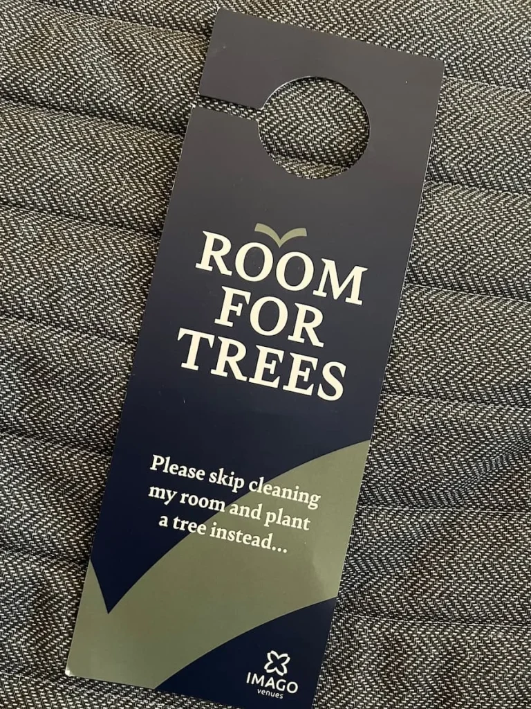 Room for trees card on bedspread at Burleigh Court Hotel, Loughborough