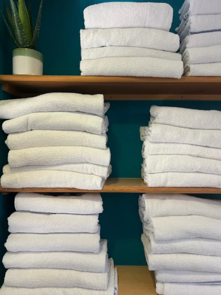 Stacks of white towels at the Burleigh Springs spa at Burleigh Court Hotel, Loughborough