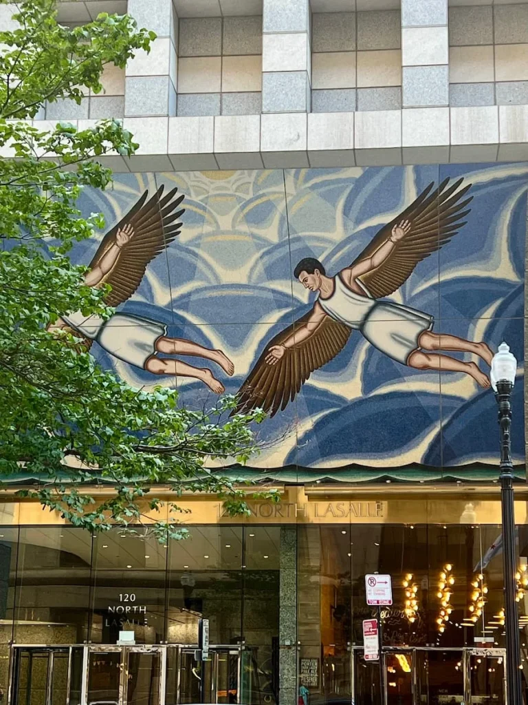 Angels with brown wings and a blue heaven sky background at the Pedway tour meeting point in Chicago. One of the non touristy things to do in Chicago