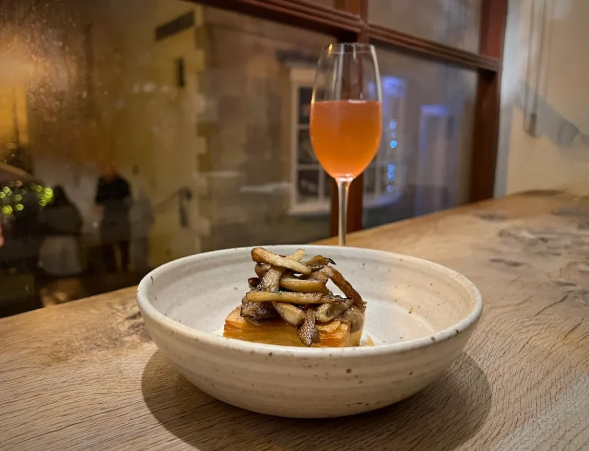 Orange wine and a mushroom small plate at OAK Restaurant in Bath