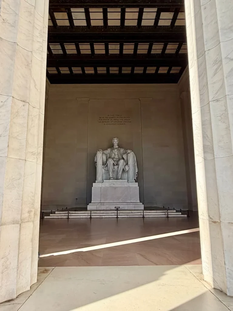 Abraham Lincoln statue made from white marblethrough columns, Washington DC