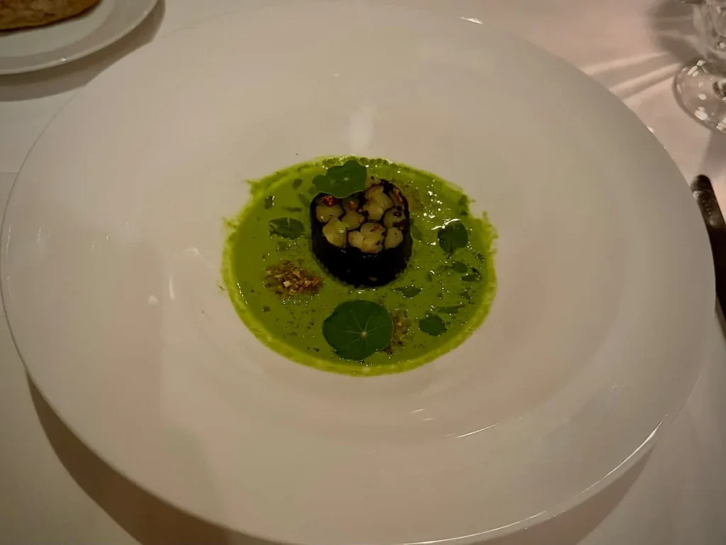 Appetizer at Elizabeth's Washington DC. Poached white asparagus with nori and oyster leaf