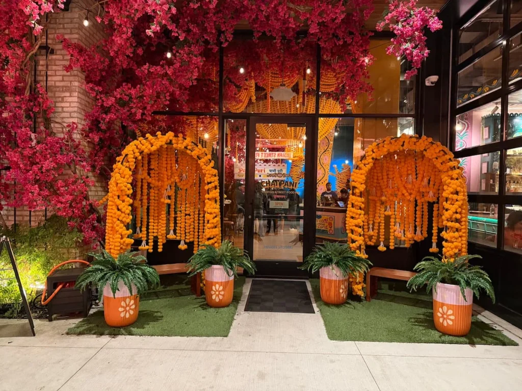 Chai pani marigold floral seat exterior, cerise pink flowers and lights, Washington DC