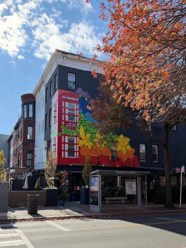 Logan Circle pub street art, Washington DC. The mural features a red London style phone box. Logan Circle has a few sustainable hotels in Washington DC