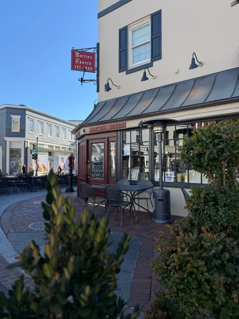 Martin's Taverna from teh side covered in foliage with seating outside Georgetown Washington DC