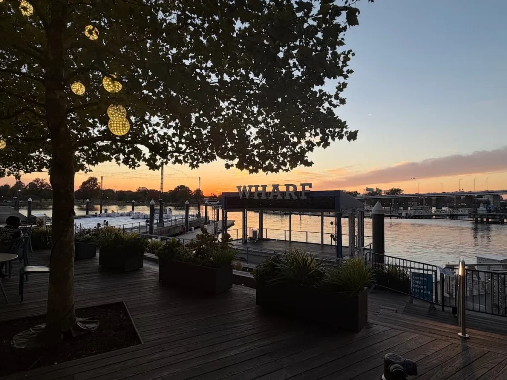 The Wharf sign, Washington DC with a sunset appearing behind