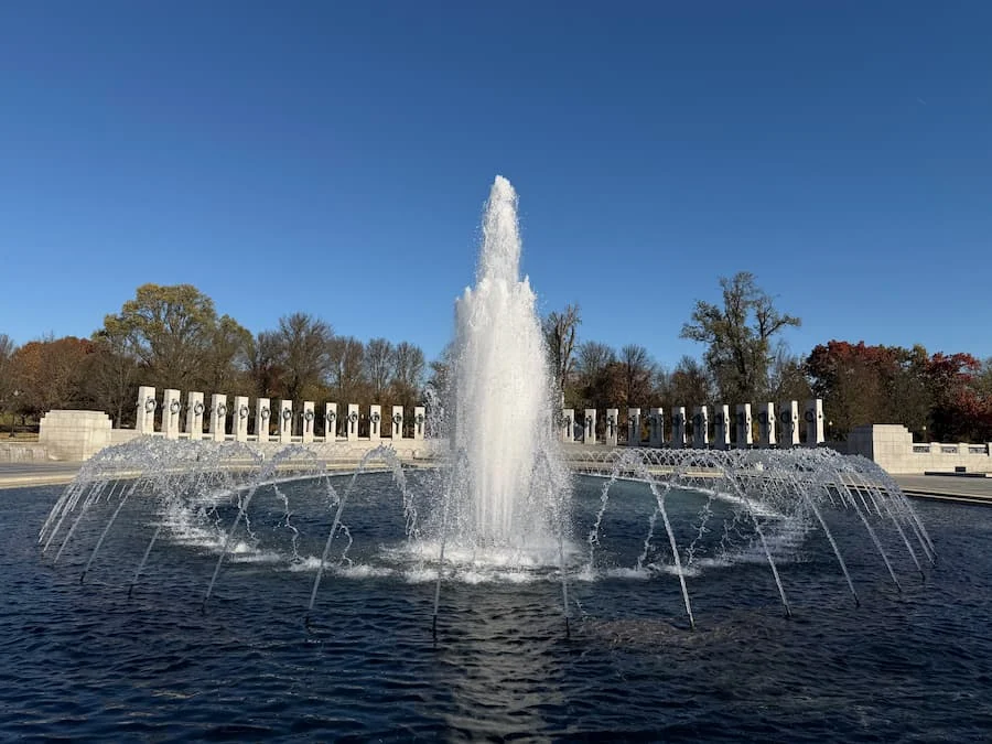 World War II Memorial fountains, Washington DC against blue skies