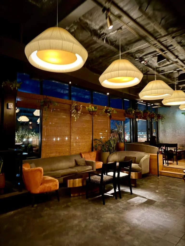 Comfy sofas and lounge area at Wild Days Rooftop Bar, Washington DC at the Eaton DC Hotel