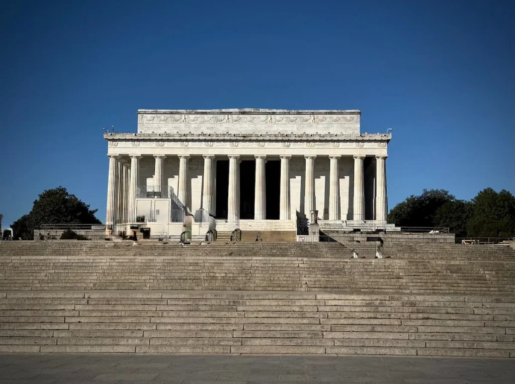 Exterior of the Lincoln Memorial in Washington DC with the columns and stairs right outside the stone temple