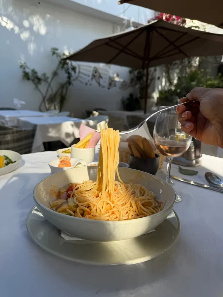 Tomato adn courgette spaghetti being eaten with a fork at Chex Achour, Hammamet