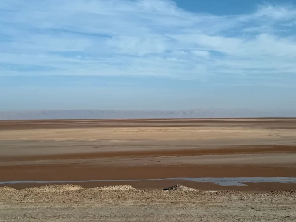 The Salt Lakes of Chot el Djerid in Tunisia. Th ebright blue sky against the white, sandy tones of the salt on the ground