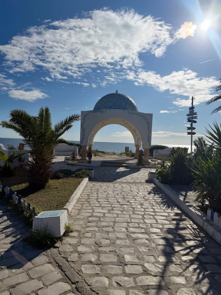 The dome-like structure of the coastal walk at Hammamet old town. The structure is painted white with a blue dome and faces the sea, Tunisia
