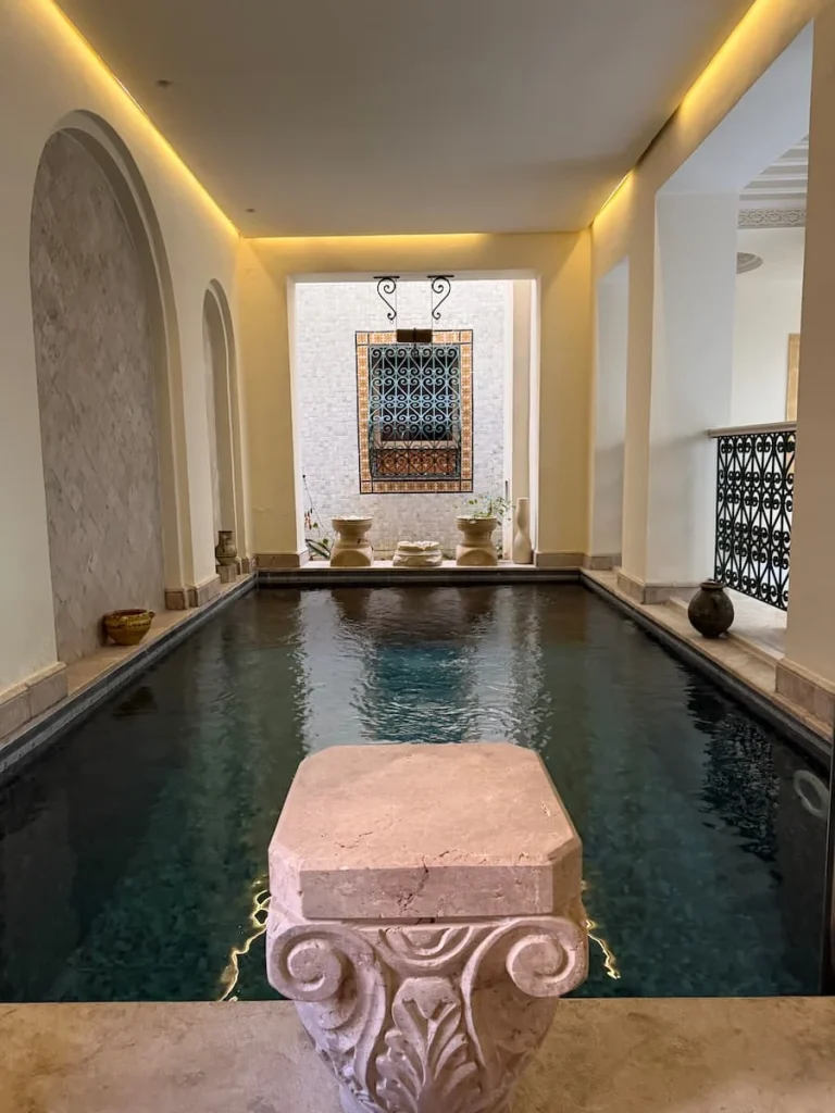 Dar Alouini swimming pool surrounded by mosaics on the ground floor in Kairouan