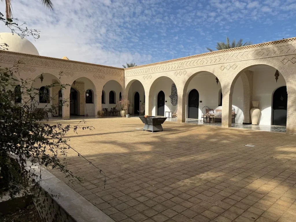 Dar Yomma Guesthouse internal courtyard with archways and lovely foliage for guests to enjoy